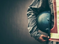 road worker holding a hard hat